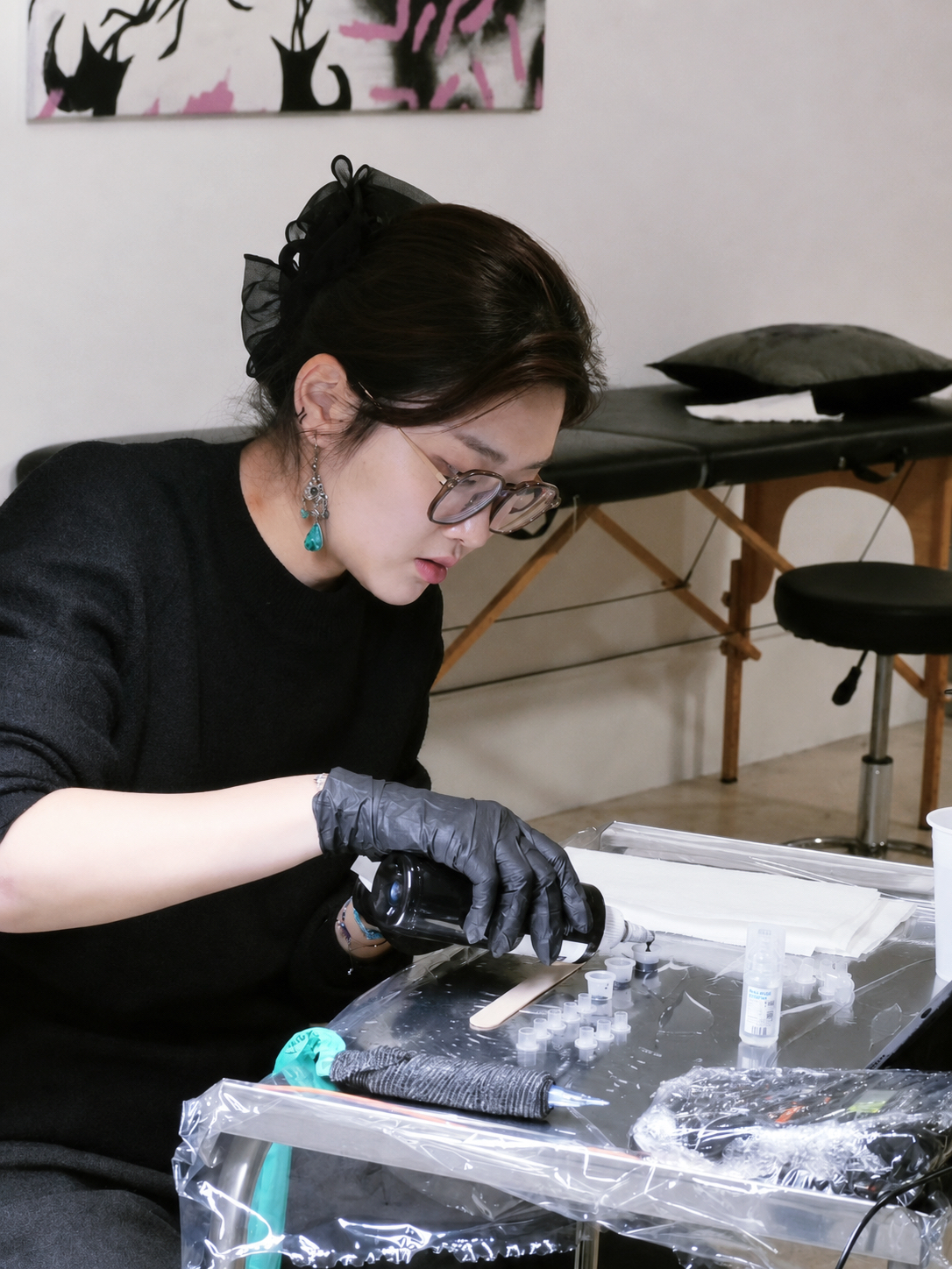 Tattoo artist preparing a delicate colour tattoo