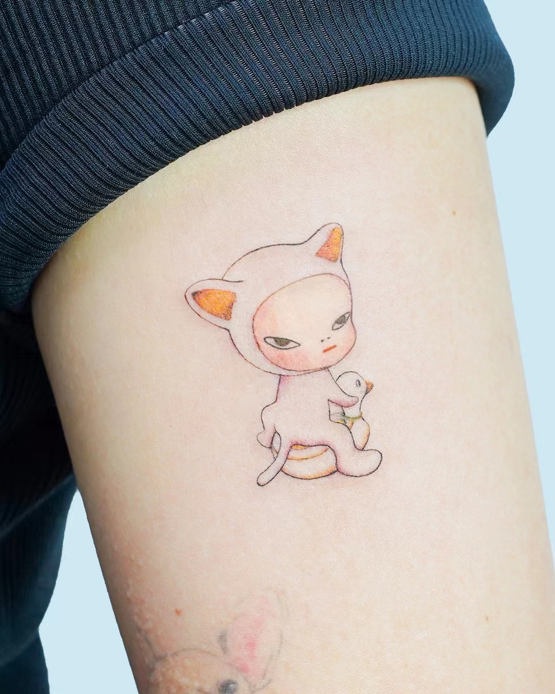 Delicate illustrated character tattoo with blush colour